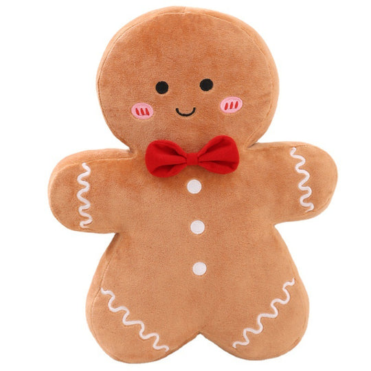 A gingerbread pal plushie on a white background. Christmas Plushie, Gingerbread Plushie, Squishmallow.