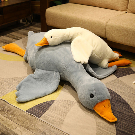 Two Quackers plushies, one large grey and one mega white, stacked together on a couch in a cozy setting, Quackers, Goose plushie, Family, Stack, Large, Mega, Couch, Soft Plush, Cute Plush, Plush, Goose Toy, Stuffed Toy. Plushies, Plush Dolls, Cute Plush, Plush, Soft Dolls, Toy Dolls, Toy, Toys, Squishy, Soft, Soft Toys, Stuffed Toys, Plush Toy, Plush Toys, Premium, Quality, Adorable, Cuddly, Playful, Collectibles, Huggable, Kids Toys, Children's Gifts, Gift Ideas, Gift, Gifts, Plush, Teddy Bear.