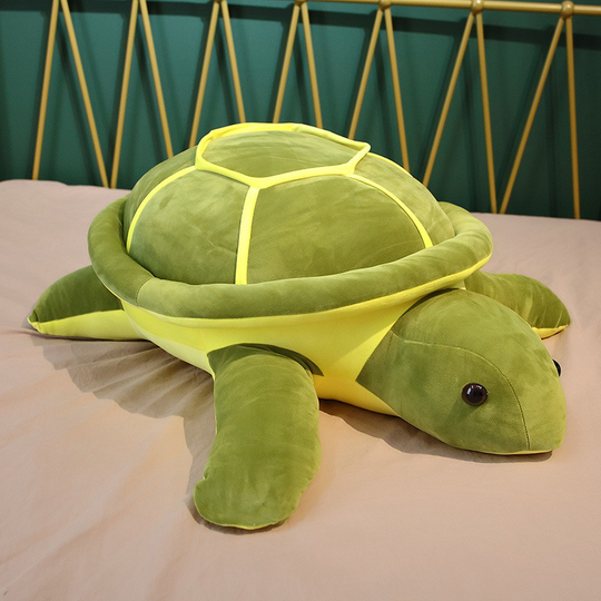 A Snuggle Turtle plushie sitting on a bed. It has a cute and huggable turtle design. Snuggle Turtle, Plushie, Sitting, Shelf, Turtle, Soft, Huggable, Toy, Toys, Squishy, Soft Toys, Stuffed Toys, Plush Toy, Plush Toys, Premium, Quality, Adorable, Playful, Collectibles, Huggable, Kids Toys, Children's Gifts, Gift Ideas, Gifts, Teddy Bear