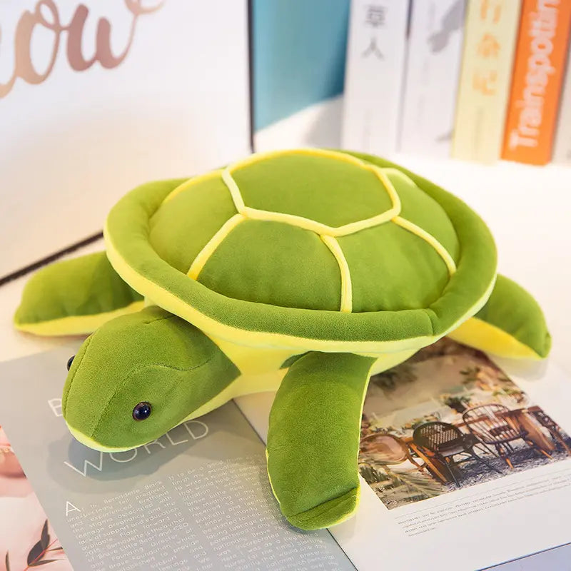 A Snuggle Turtle plushie placed on a desk. It is soft and features an adorable turtle design. Snuggle Turtle, Plushie, Desk, Turtle, Soft, Toy, Toys, Squishy, Soft Toys, Stuffed Toys, Plush Toy, Plush Toys, Premium, Quality, Adorable, Playful, Collectibles, Huggable, Kids Toys, Children's Gifts, Gift Ideas, Gifts, Teddy Bear